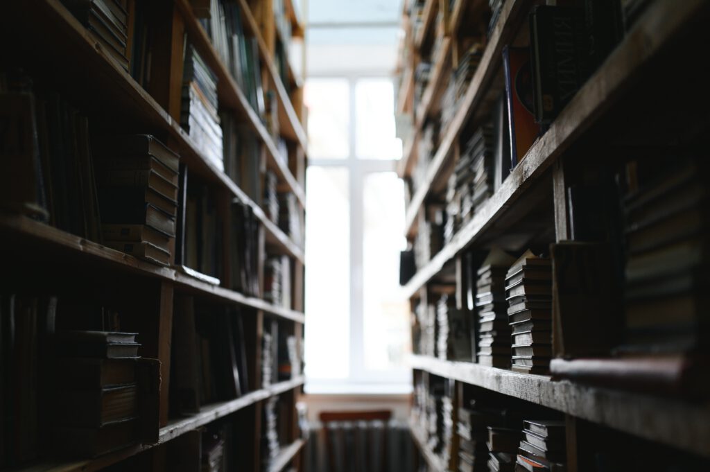Books on shelves with light