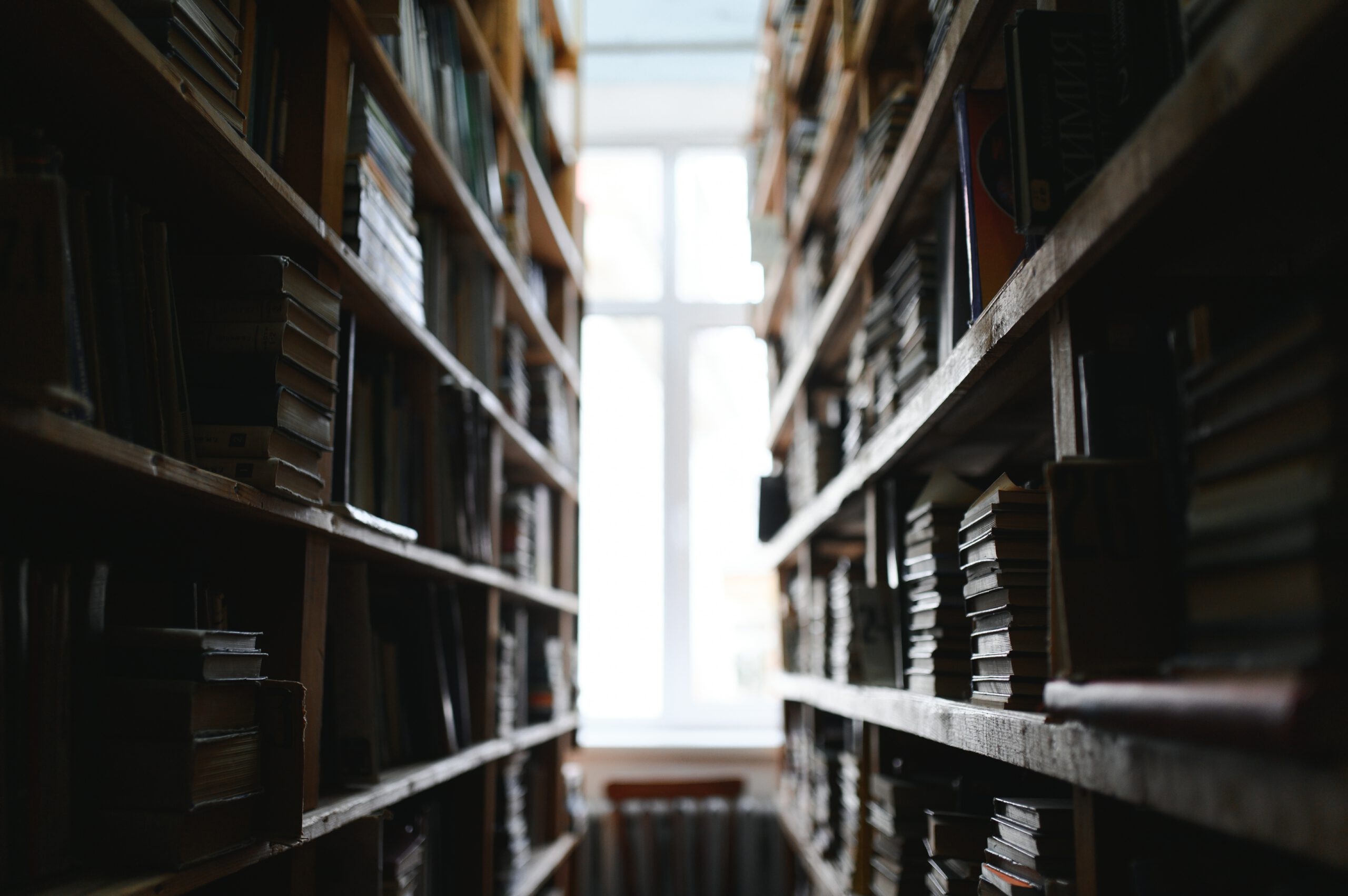 Books on shelves with light