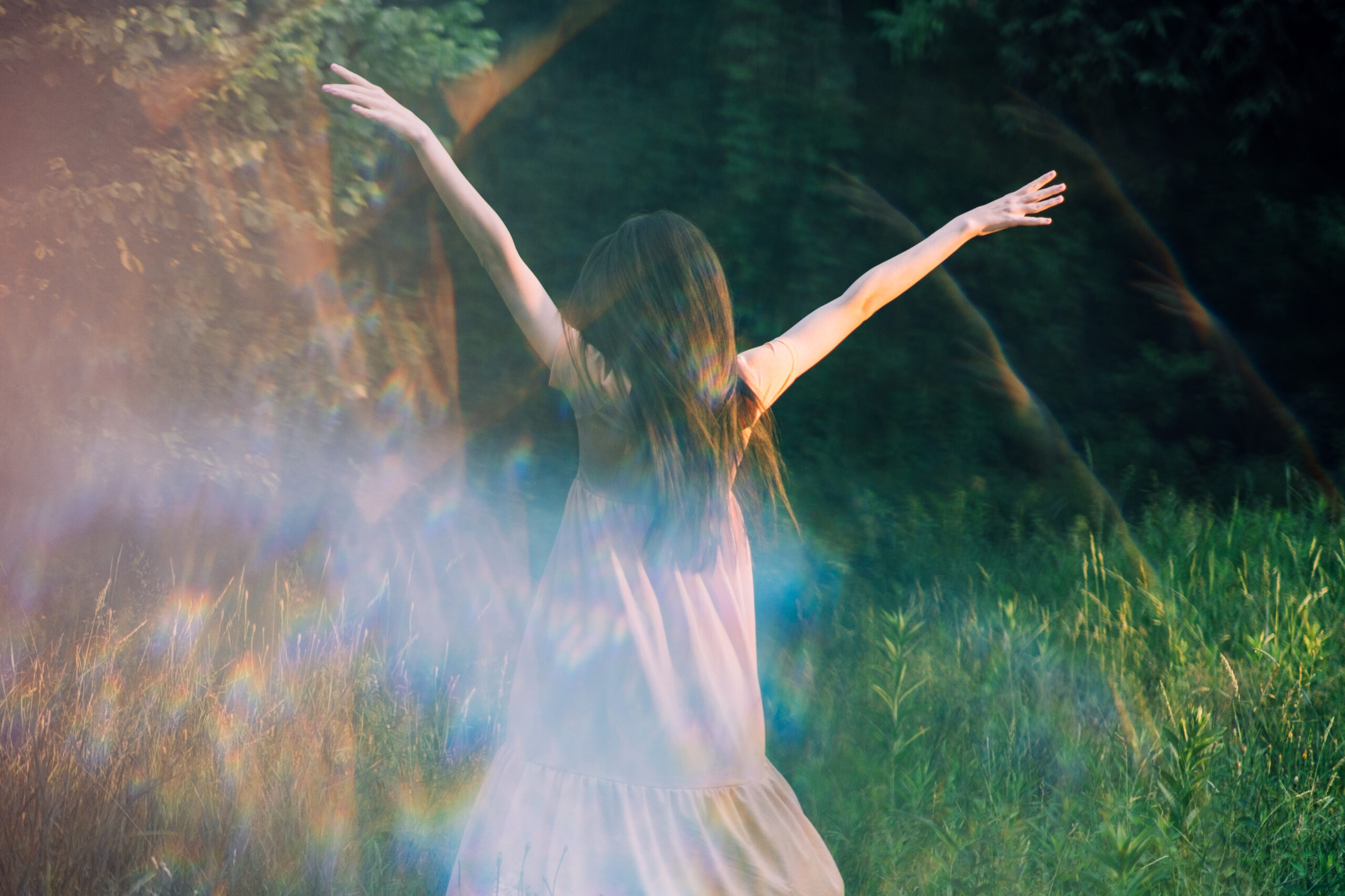 a woman in nature expressing herself